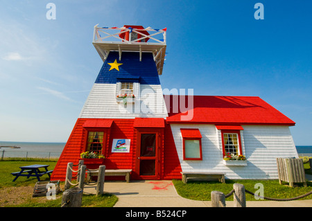 Lighthouse with Acadian flag in Grande Anse Acadian Peninsula New Brunswick Stock Photo