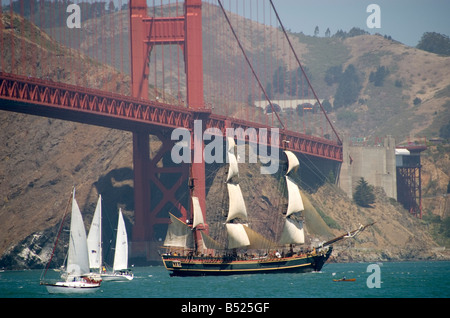 USS Bounty enters San Francisco Bay after sailing under the Golden Gate Bridge for the Parade of Tall Ships Stock Photo