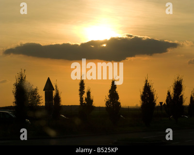 A cloud in the sky over trees in the German countryside as seen on 10 9 08 Stock Photo