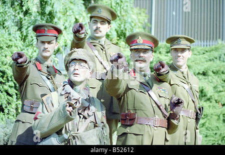 Cast of Blackadder Goes Forth in costume for photocall Black Adder Rowan Atkinson Baldrick Tony Robinson Captain Kevin Darling Tim McInnerny Lt the Honarable George Colhurst St Barleigh Hugh Laurie Sir Anthony Cecil Hogmanay Melchett Stephen Fry Salute saluting First World War WW1 Wartine uniform Cunning Plan September 1989 1980s Stock Photo