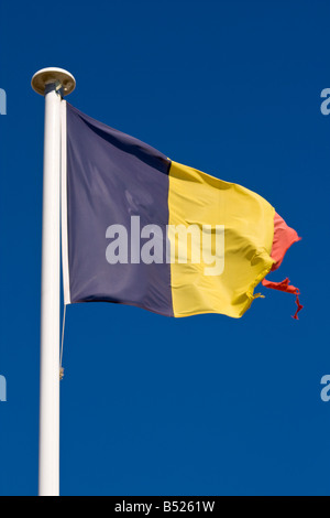 A tattered Belgian flag waves in the wind Stock Photo