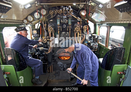 Inside the cab of an A1 Peppercorn class Pacific steam engine  The train is 60163 Tornado, on the Great Central Railway. Stock Photo