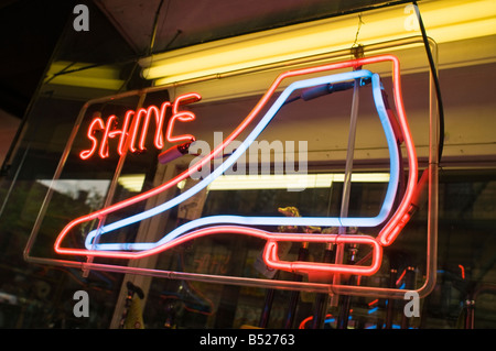 colorful neon light sign in NYC shoe repair store window Stock Photo