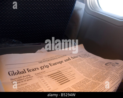 The Wall Street Journal s October 13th 2008 page on the financial crisis seen on an airplane Stock Photo