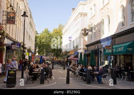 people sitting at street cafes on Museum Street Bloomsbury London Stock Photo