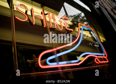 colorful neon light sign in NYC shoe repair store window Stock Photo