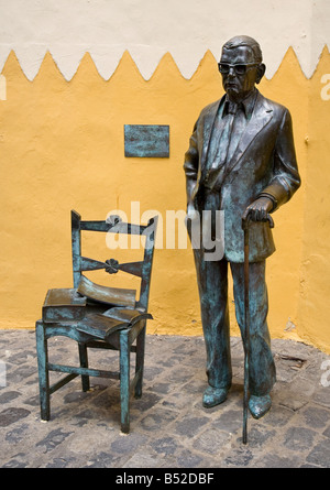 Statue of Nestor Alamo with books on seat Las Palmas Gran Canaria Spain Stock Photo