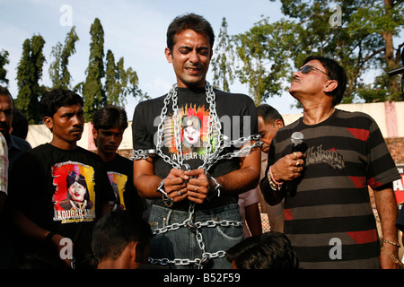 Jadugar (magician) Akash of India fully chained and hand cuffed for a fire escape show in india Stock Photo