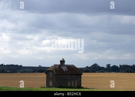 Boarded-up house, Felixstowe Ferry, Suffolk, UK. Stock Photo