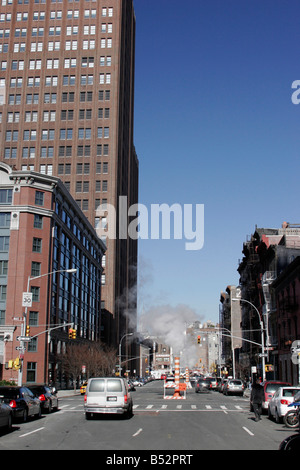 Smoke from street vents near Soho in Manhattan, New York Stock Photo