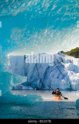 Male kayaker in Bear Cove Lagoon Resurrection Bay Alaska Kenai Fjords NP  Kenai Peninsula summer Stock Photo