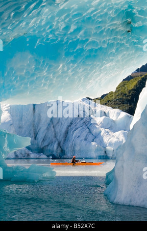 Male kayaker in Bear Cove Lagoon Resurrection Bay Alaska Kenai Fjords NP  Kenai Peninsula summer Stock Photo