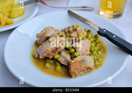 Spezzatino, a Roman veal stew with fresh green peas. Stock Photo