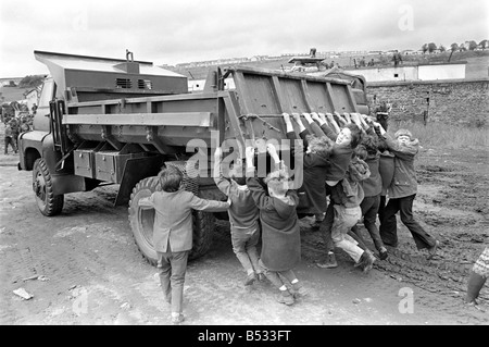 Northern Ireland June 1972. Children and soldiers play at the army base on the Foyle Road. The army were in the process of abandoning the camp. June 1972 72-7009-011 Stock Photo