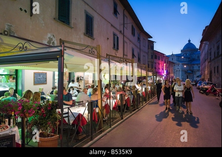 Restaurant at night on Via Santa Maria leading to the Duomo and Piazza dei Miracoli, Pisa, Tuscany, Italy Stock Photo