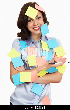 Woman covered in sticky notes Stock Photo