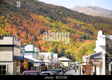 Arrowtown in New Zealand, former gold mining town in the Otago region of South Island with autumn fall colours on the leaves and hills Stock Photo