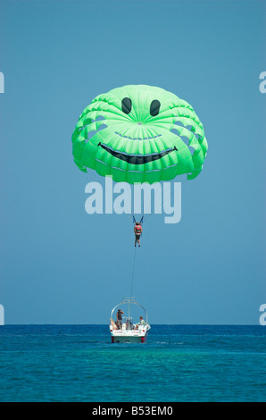 Two young woman parasailing over sea Crete Rethymno Greece September 2008 Stock Photo
