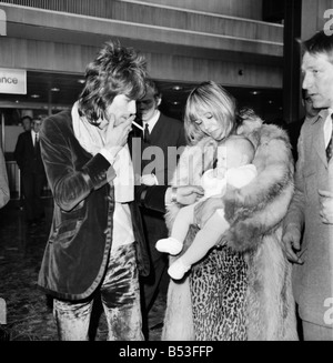 Rolling Stones, Charlie Watts and Keith Richard arrived at Heathrow Airport today from Los Angeles. They were met by Charlie Watts' wife and daughter, and the girlfriend of Keith Richard, Anita Pallenberg with their 4 months old baby Marlon. (left to right) Keith Richard and Charlie Watts pictured at Heathrow Airport . December 1969 Z11832-001 Stock Photo