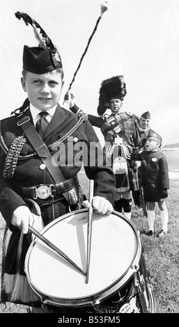 The white family who are all involved in the Boys Brigade David is a member of the pipe band Mr Colin White is Captain of the 12th South lSheilds Company Mrs White is Company Junior Section Officer and the seven year old daughter Deborah is the group s mascot Stock Photo