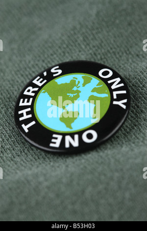 Close up of planet earth pin on shirt