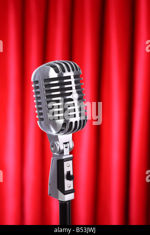 Microphone with red curtain background Stock Photo - Alamy