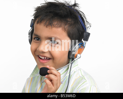 asian boy enjoying music with headphones Stock Photo