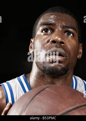 African basketball player shooting basketball Stock Photo