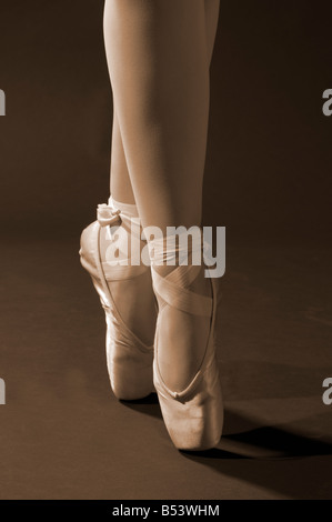 Close up of a ballet dancer enpointe in sepia Stock Photo