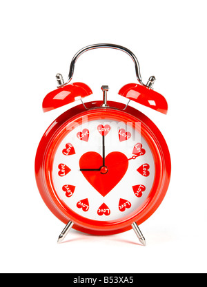 Concept image Alarm clock with every hour set on love Stock Photo