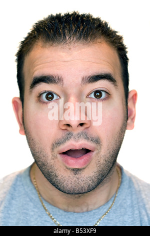 A young man with a surprised or scared look on his face Stock Photo
