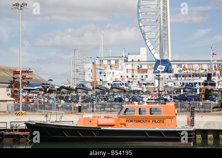 A Pilot boat moored in Camber Dock with the Spinnaker Tower in the background, Portsmouth, Hampshire, England. Stock Photo