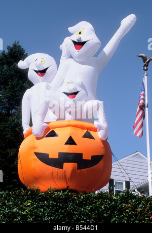 Halloween pumpkin and three ghosts outdoor decoration. American holidays USA Stock Photo
