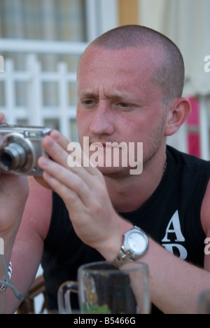 Man using digital compact camera Stock Photo