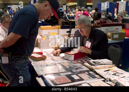 Stamp Dealer Offers Stamps For Sale At A Booth At The American ...