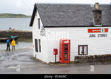 Village store or shop and harbour at Craighouse Stock Photo