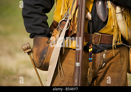 Man wearing trapper costume demonstrating black powder rifle at Steam Engine Show at Westwold, 'British Columbia', Canada Stock Photo