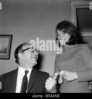 Politics. Transport. Road safety: The Minister of Transport, Mr. Fred Mulley was 'breathalysed' this morning from Police Sergeant Syd Furner, and then had a blood sample taken by experimental Lab. Technician Gillian Martin as a demonstration for the Press. Gillian Martin with the Minister after the blood sample had been taken with the Minister smiling at his plastered thumb. November 1969 Z10861-003 Stock Photo