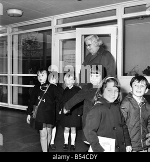 Education School: Miss Marjorie Wilson, sister of the Prime Minister, did not join in the Teachers Strike but attended her school at Biscoveey, Cornwall. In the absence of staff teachers, headmistress Miss Wilson shepherds the children out of school and into the school bus. November 1969 Z11197 Stock Photo