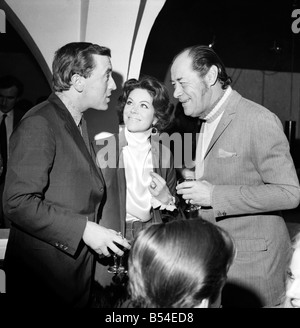 Photographer David Bailey today held a party in a Kings Road chelsea club to launch his book attended the party. Left to right - David Frost, Rachel Roberts, and Rex Harrison. November 1969 Z10810 Stock Photo