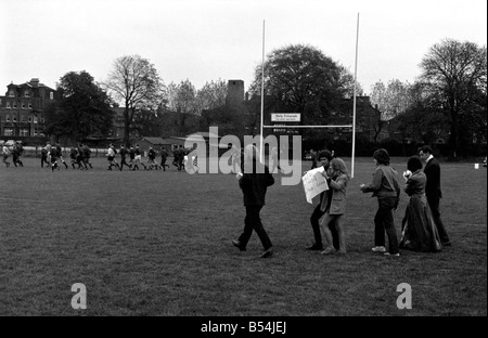 Sport: The South African springbok rugby team that flew in yesterday to be welcomed by anti-apartheid demonstrators at London Airport were shouted at and had banners waved in their faces during their practice session at the Richmond Athletic Association ground. ;The demonstrators were escorted from the ground by the police. ;The demonstrators rush on to the pitch towards the players. ;October 1969 ;Z10491 Stock Photo