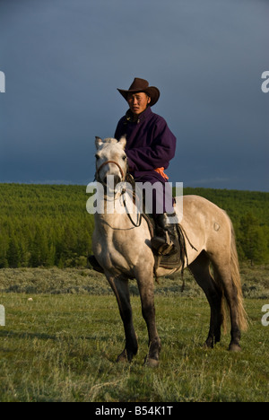 Nomad on a horse in Northern Mongolia Stock Photo