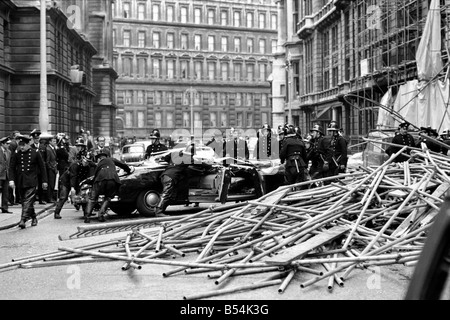 Police and fireman swarm at the scene where a 100ft framework of ...