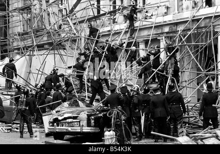 Police and fireman swarm at the scene where a 100ft framework of ...