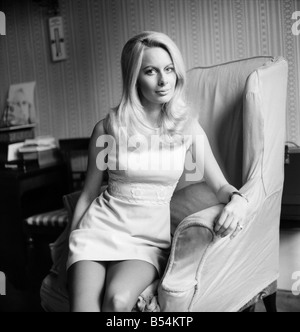 Andrea Lloyd model and actress aged 23, blonde and green eyed, Hampshire born and bred will appear shortly in the Michael Winner Film The Games. She also has a part in the latest James Bond Picture. Andrea photographed in her home in Kensington. November 1969 Z11160-006 Stock Photo