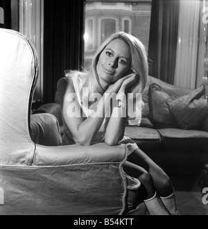 Andrea Lloyd model and actress aged 23, blonde and green eyed, Hampshire born and bred will appear shortly in the Michael Winner Film The Games. She also has a part in the latest James Bond Picture. Andrea photographed in her home in Kensington. November 1969 Z11160-007 Stock Photo