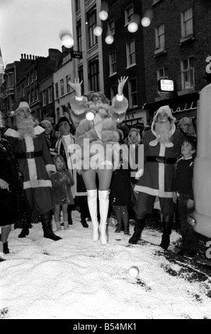 Festive Scenes. In South Molton street, Mayfair , it was snowing but it was only plastic snow that was falling. Singer Clodagh Rogers was present with Father and Mother Christmas, to open the street's Christmas display of lights. Clodagh Rogers throws a snowball. December 1969 Z11515-001 Stock Photo