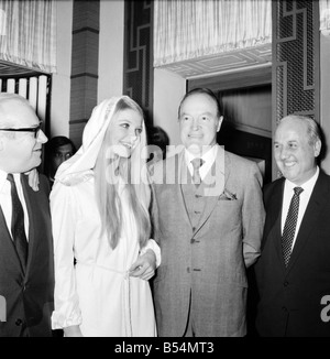 Bob Hope opens 'how to commit marriage' at The New Victoria Theatre. Bob Hope with Eva Rueber-Staier, Miss World. December 1969 Stock Photo