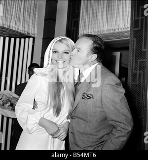 Film actor Bob Hope opens 'how to commit marriage' at The New Victoria Theatre. Bob Hope with Eva Rueber-Staier, Miss World. Stock Photo