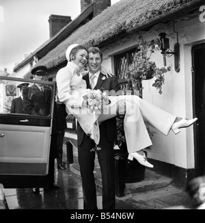 Arsenal centre half and Capt. of Northern Ireland world cup team Terry Neill had his hand full yesterday (Tues). His parcel was Stock Photo